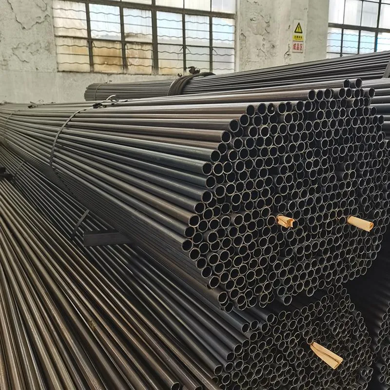 Carbon Steel Welded Pipes stacked in warehouse for structural and industrial applications
